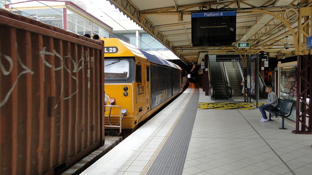 XR551 pulling freight through Flinders Street